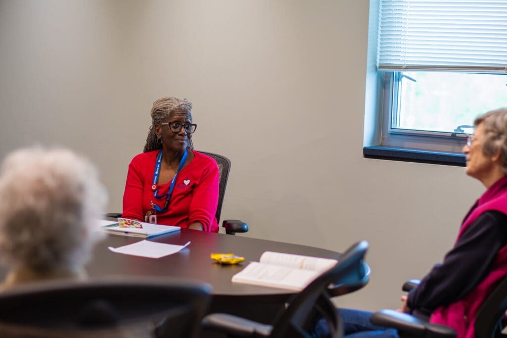 Chaplain speaking with grief group attendees